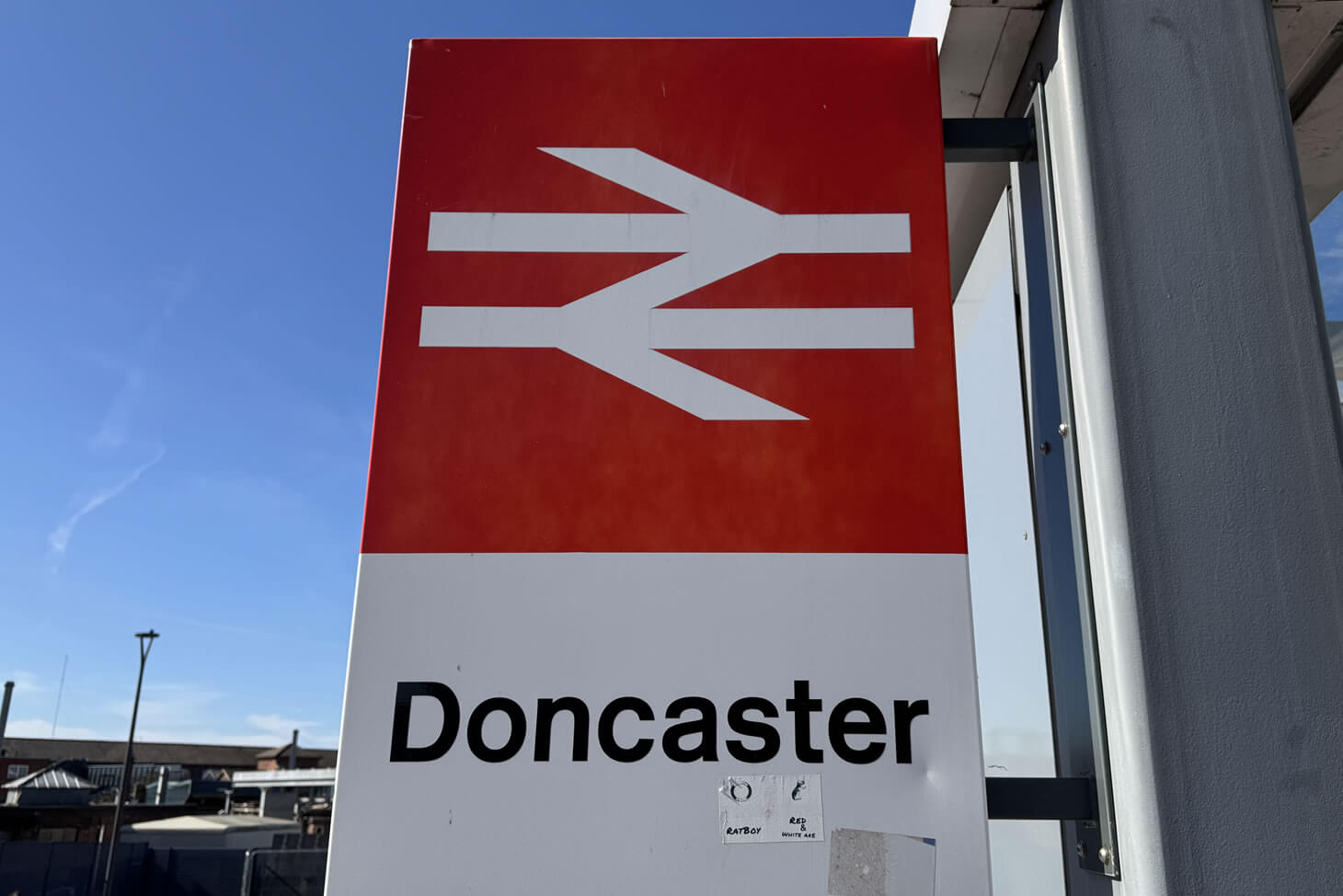 A British Rail Station Sign showing the double arrow and Doncaster placename