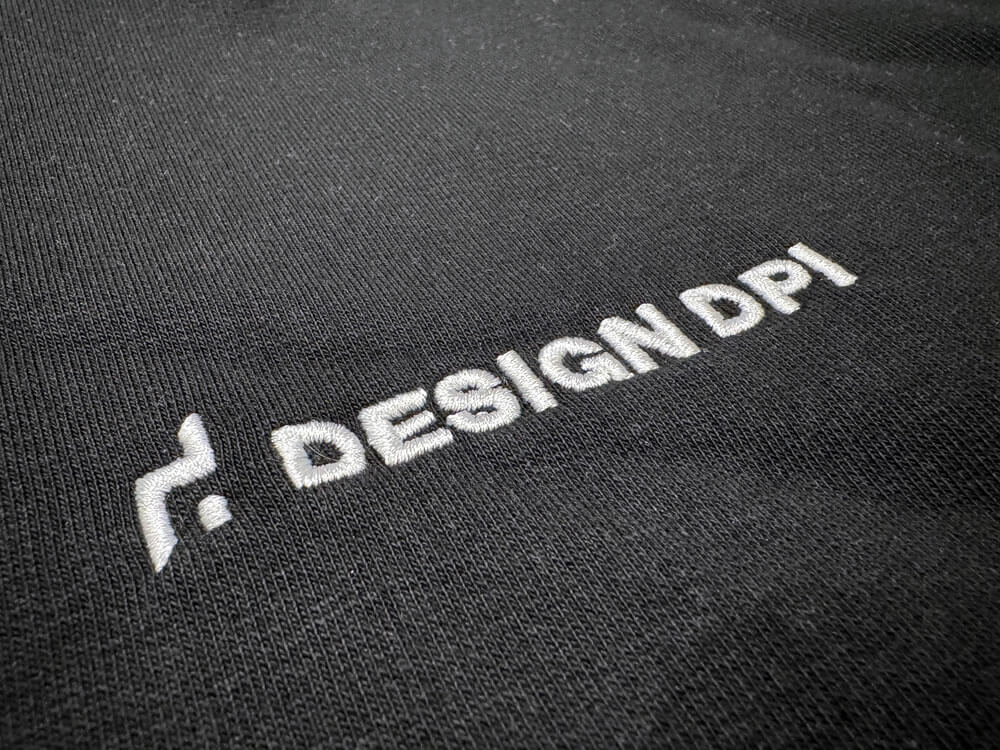Photo of DESIGN DPI's logo on clothing